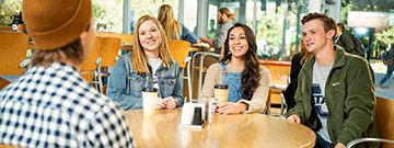 Students are taking a break at a café on the USU campus.